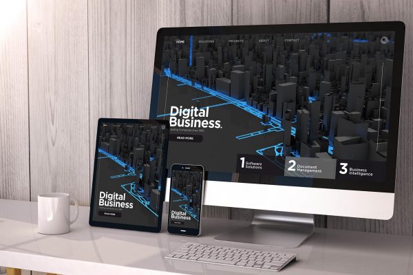 Digital generated devices on desktop, responsive digital business website on screen. All screen graphics are made up. 3d rendering.